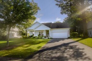 Cottage style home with double garage in an independent living community