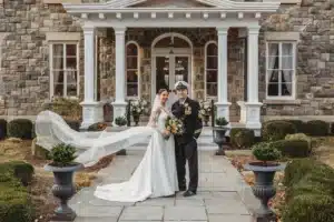 : The 2024 winners, Alex Padworski and Heather Tricoli, pictured in front of Brecknock Hall on their wedding day. Photo Credit: Amanda Seely Photography