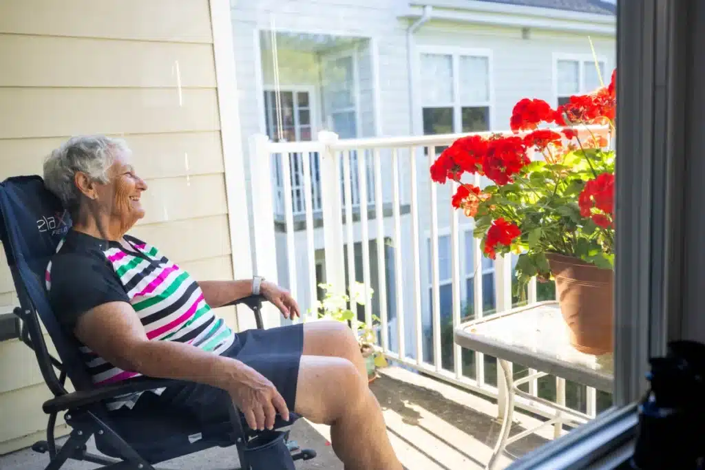 Member relaxing on the porch of a cottage